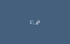a white icon with a phone on it