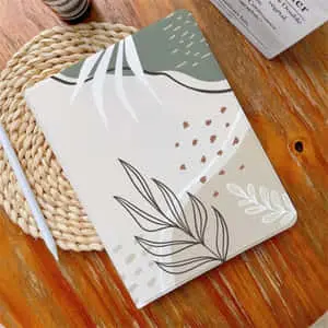 a notebook with a leaf design on it