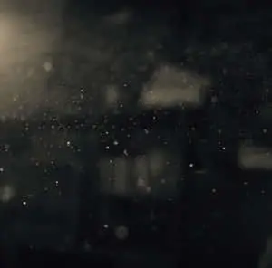 a person is standing in the rain