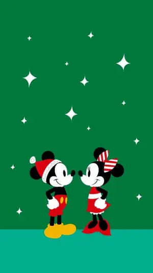 mickey mouse and minnie mouse in christmas hats